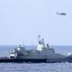 The Royal Malaysian Navy corvette KD Terengganu (FSGHM 174) and a U.S. Navy MH-60R Sea Hawk helicopter from the the guided-missile destroyer USS Pinckney (DDG 91) search for MH370 in the Gulf of Thailand (US Navy)